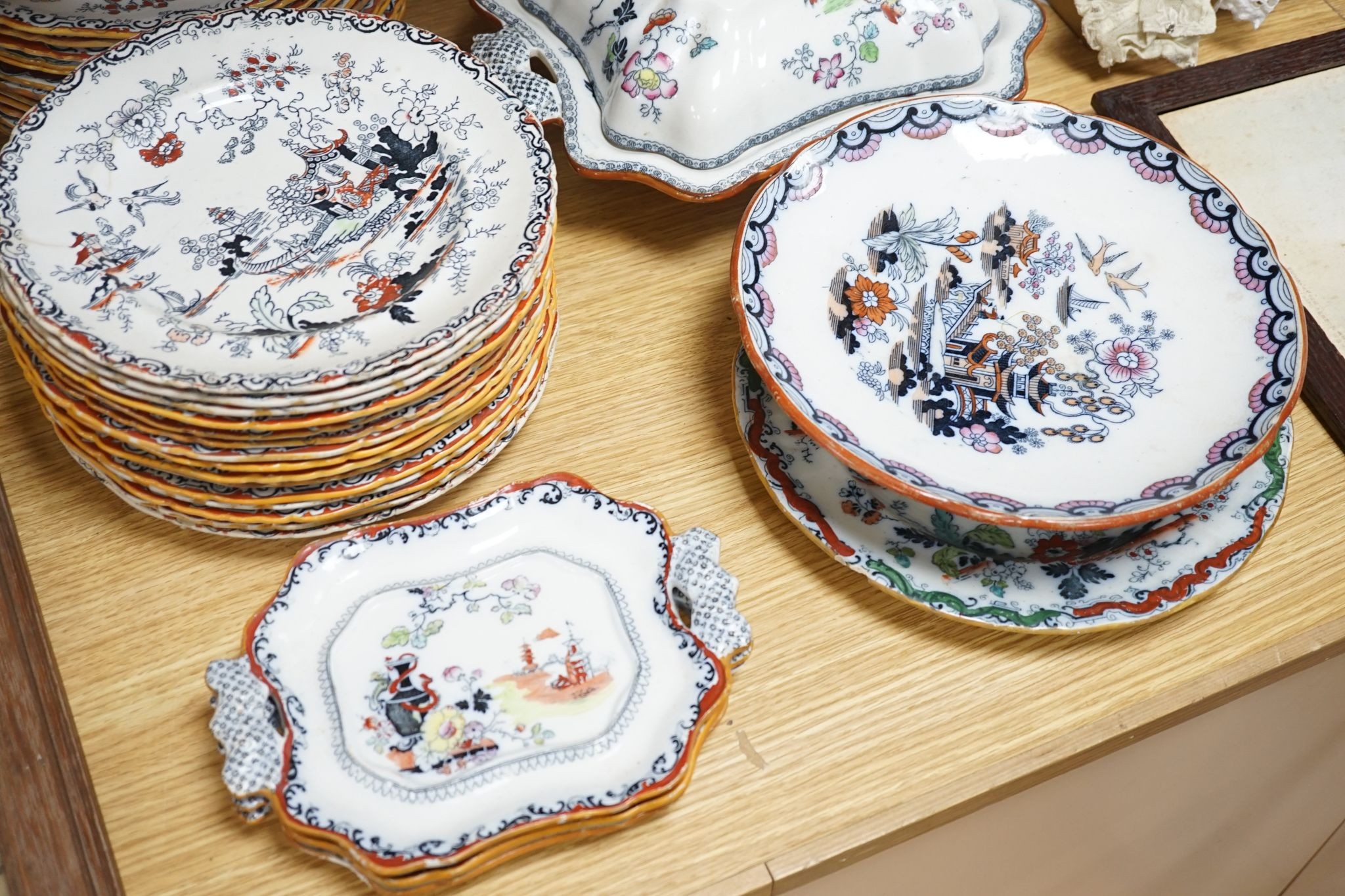 An Ashworths ironstone landscape pattern part dinner service